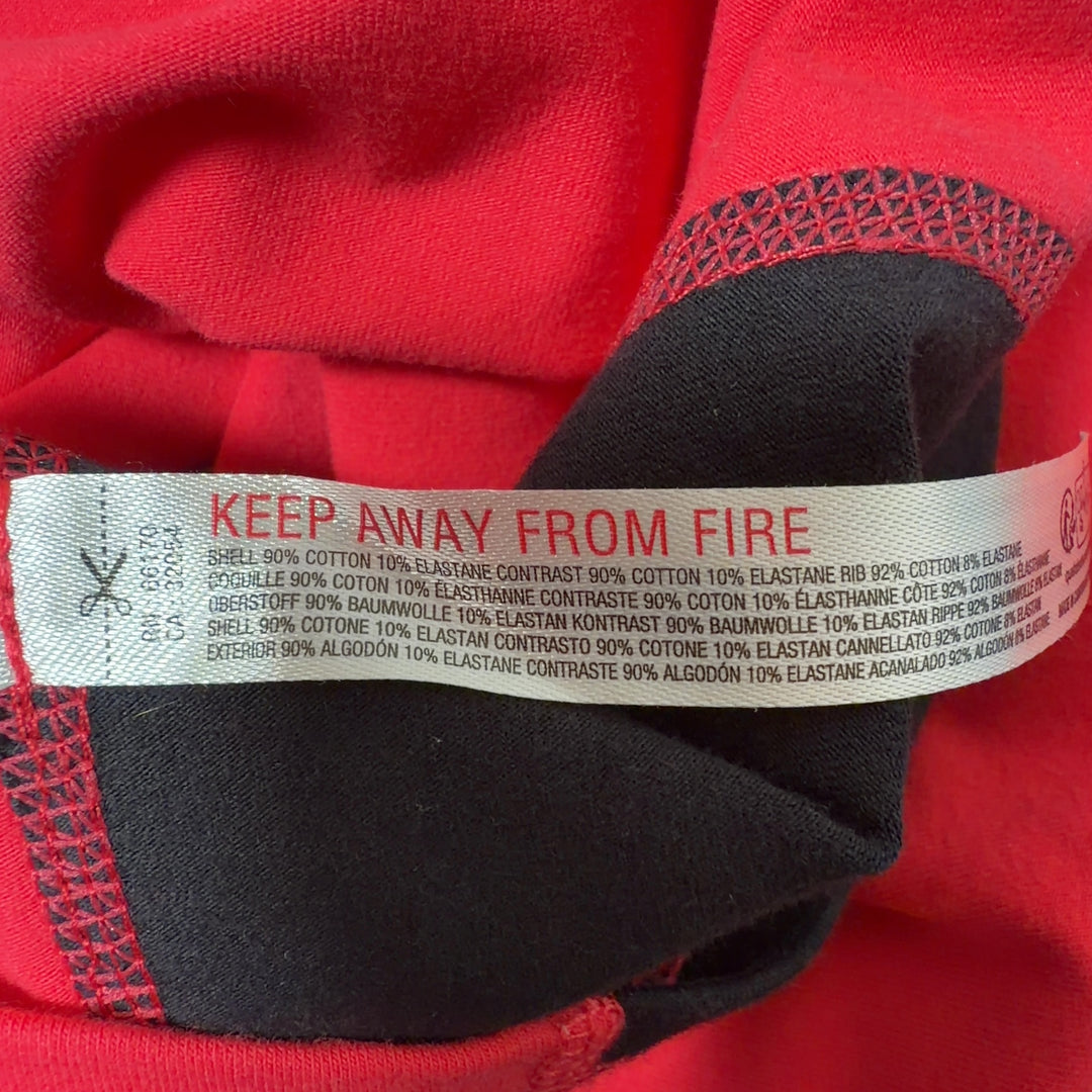 Red athletic tank top with black side panels, back view