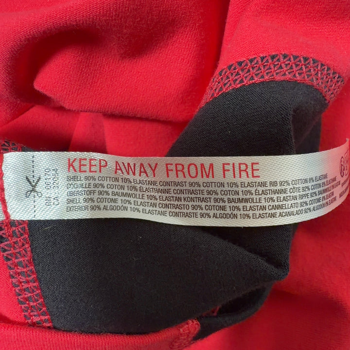 Red athletic tank top with black side panels, back view