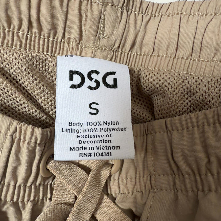 Beige DSG athletic shorts back view, showing relaxed fit and functional pockets