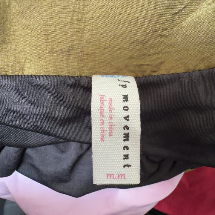 Olive nylon activewear shorts with functional side pockets and relaxed fit, side view