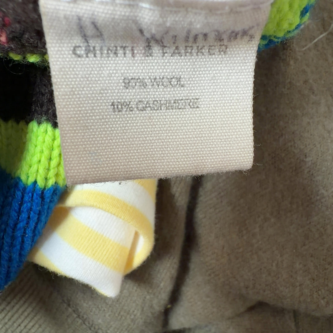 Tag view of multicolor striped cashmere wool pullover showing horizontal stripe pattern and relaxed cropped fit