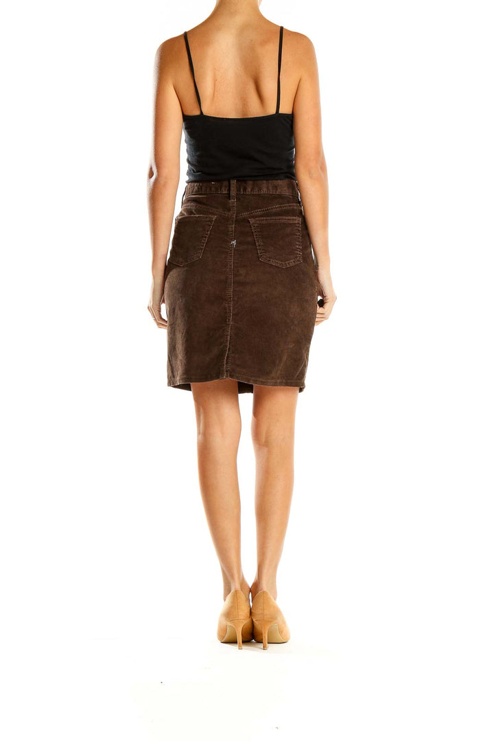 Side view of Gap 1969 brown corduroy A-line skirt on model