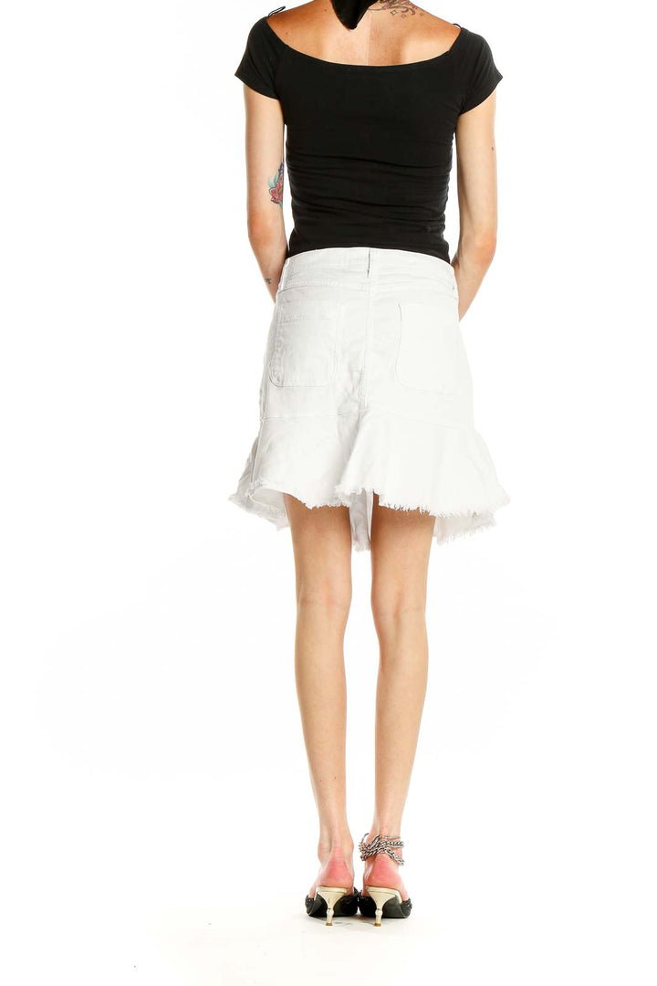 Side view of MICHAEL Michael Kors white flared denim mini skirt showing pocket detail