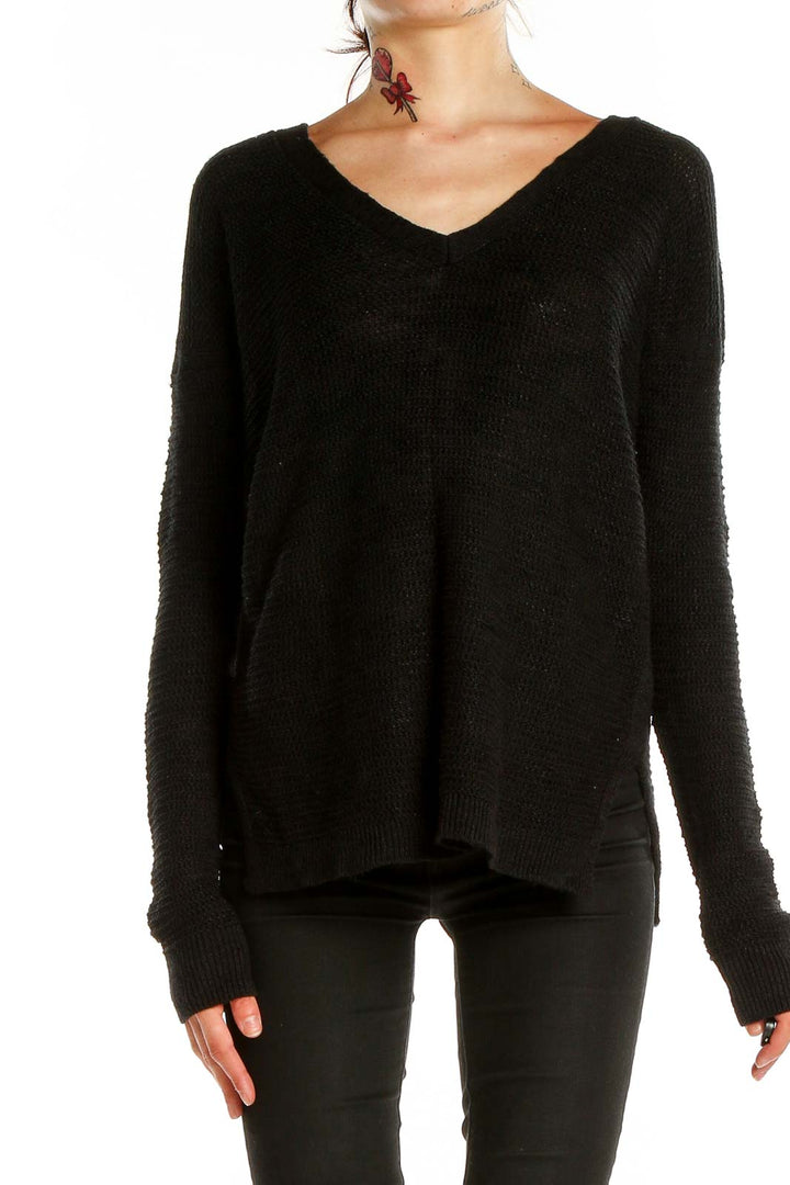 Front view of Banana Republic black V-neck knit sweater on model