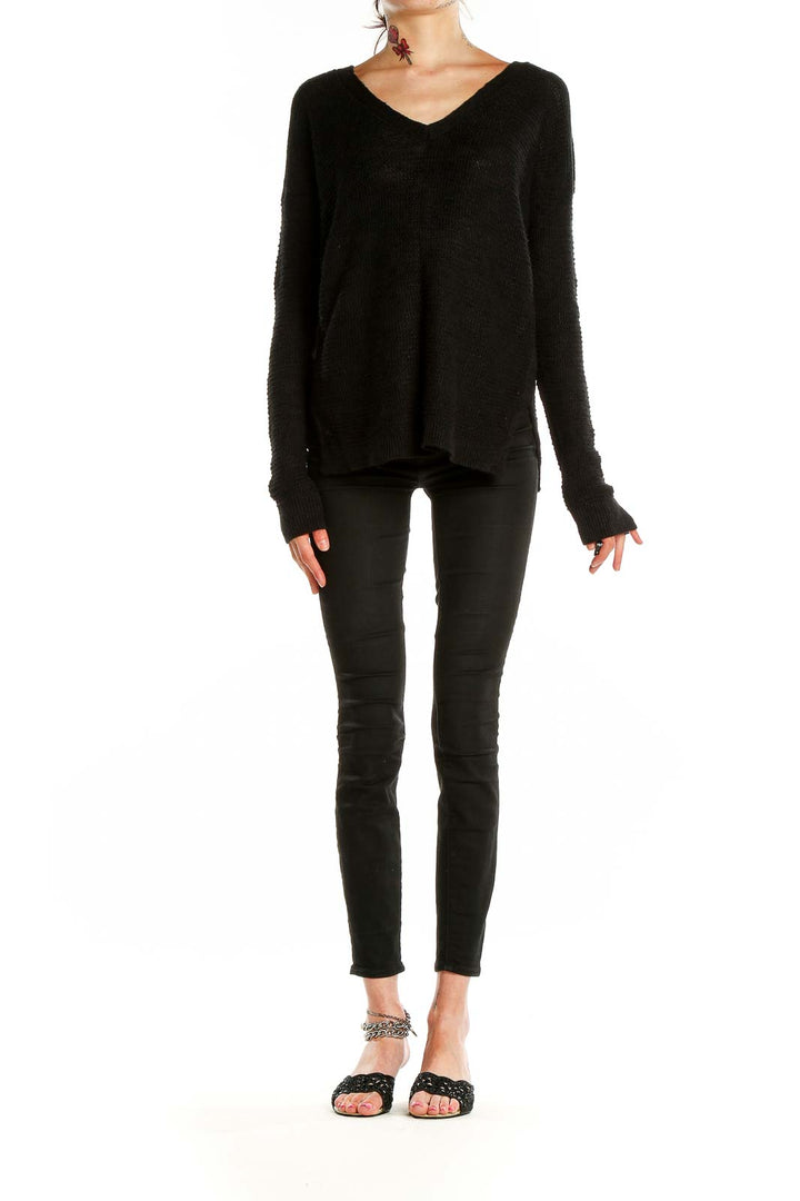 Front view of Banana Republic black V-neck knit sweater on model