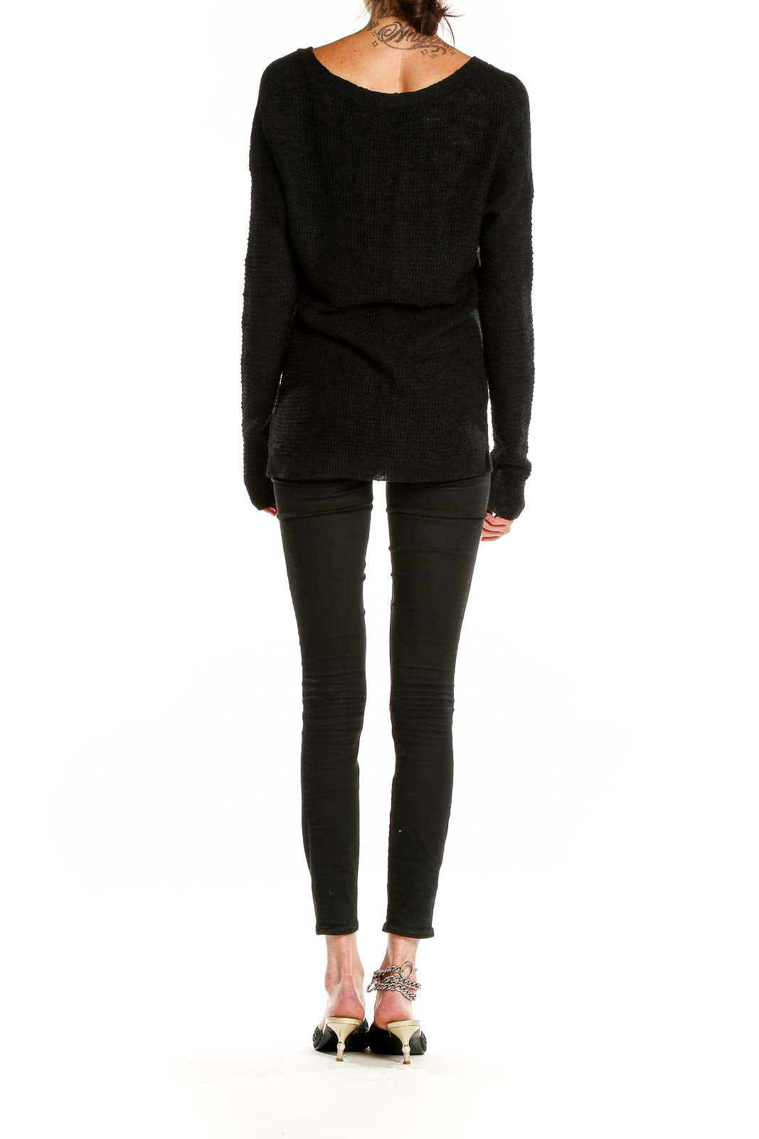 Back view of Banana Republic black V-neck knit sweater styled with skinny jeans