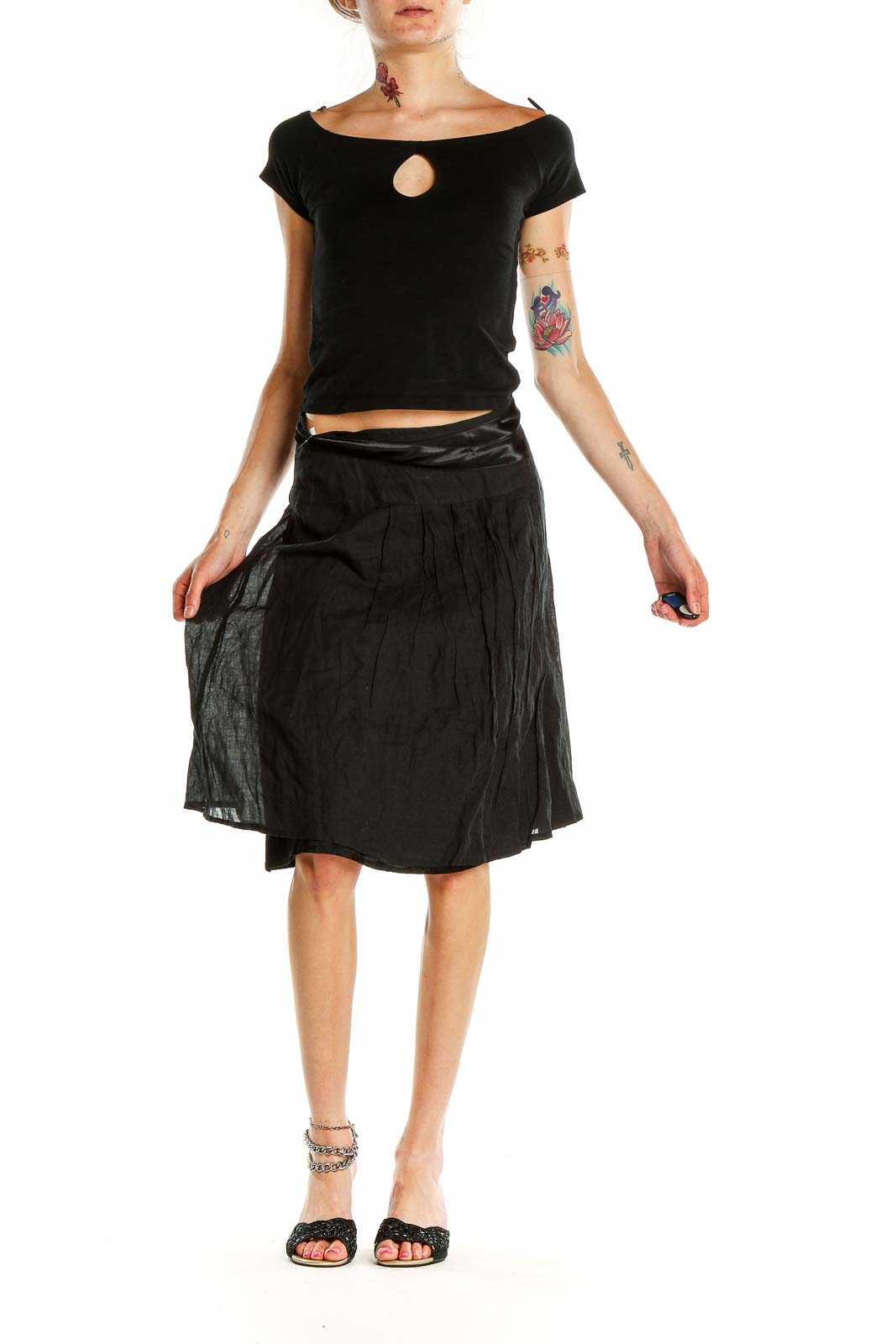 Front view of black flowy midi skirt by People Like Frank