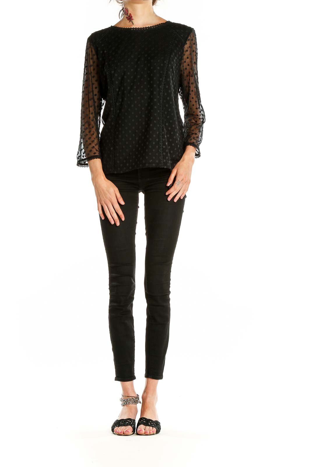 Front view of Boden black top with sheer polka dot sleeves and lace trim