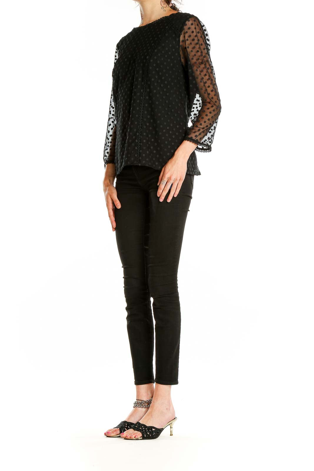 Front view of Boden black top with sheer polka dot sleeves and lace trim