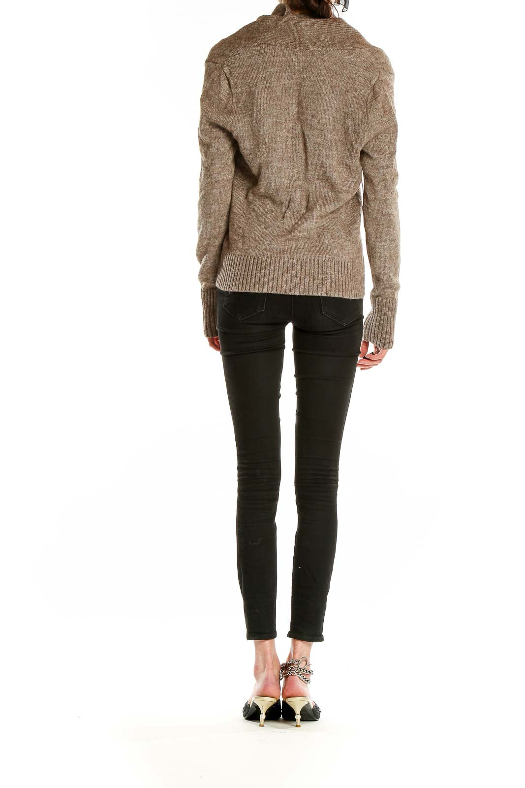 Side view of J.Crew brown V-neck ribbed sweater paired with black pants