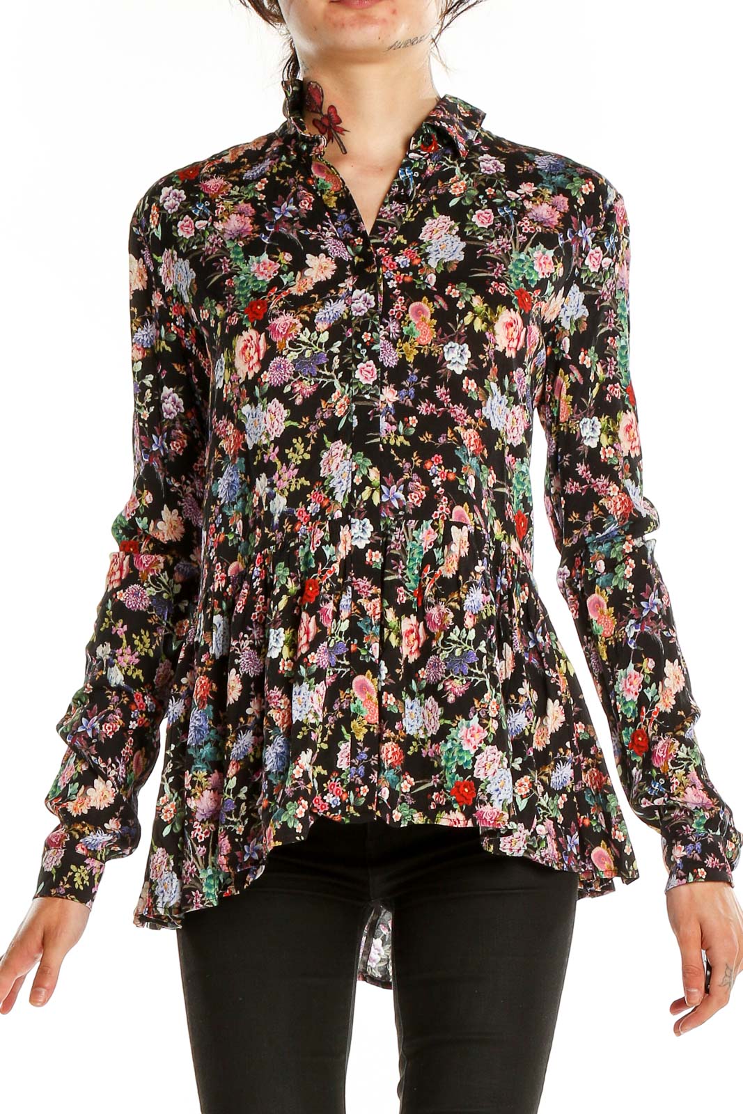 Front view of Tuckernuck black floral peplum blouse with button-up design