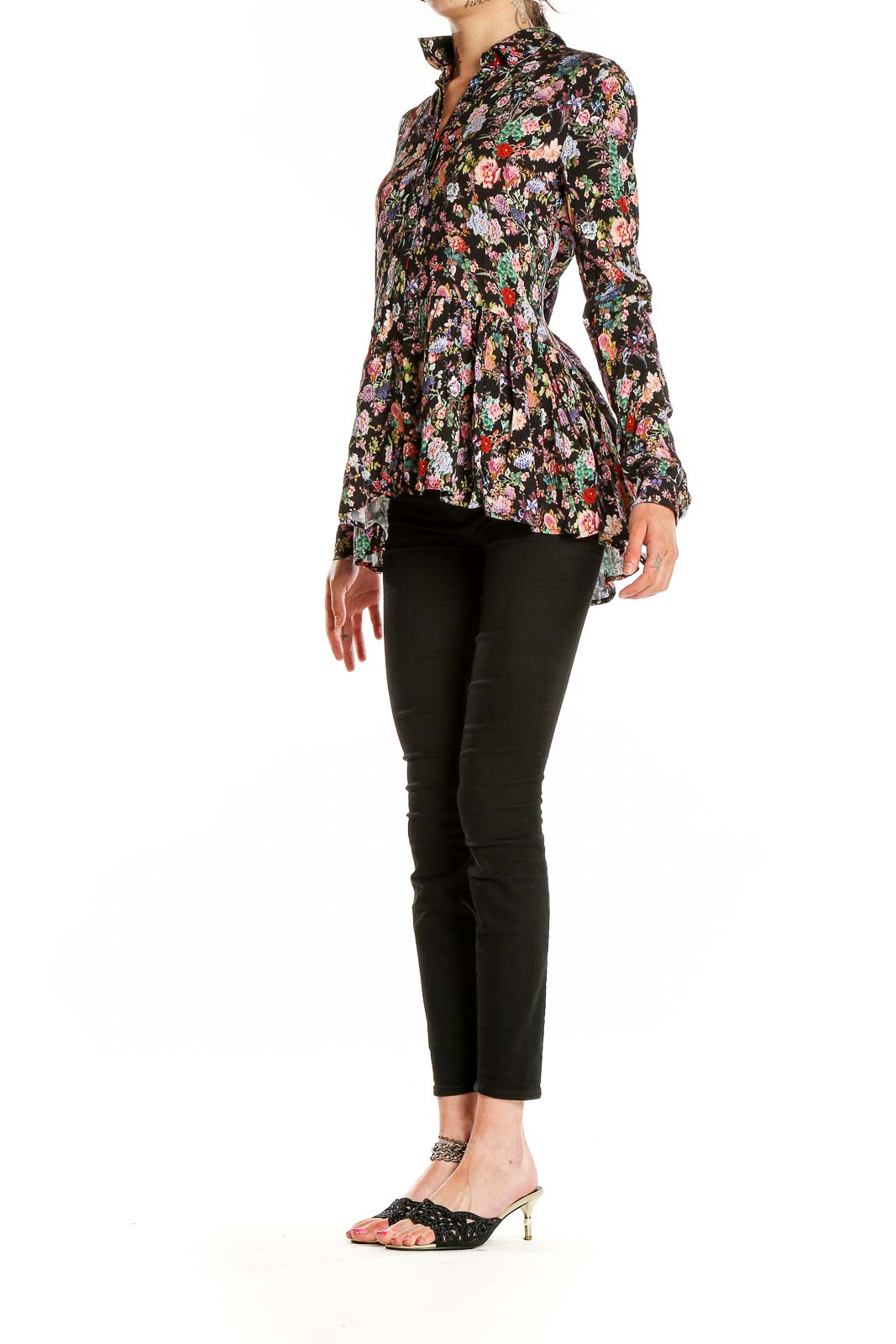 Front view of Tuckernuck black floral peplum blouse with button-up design