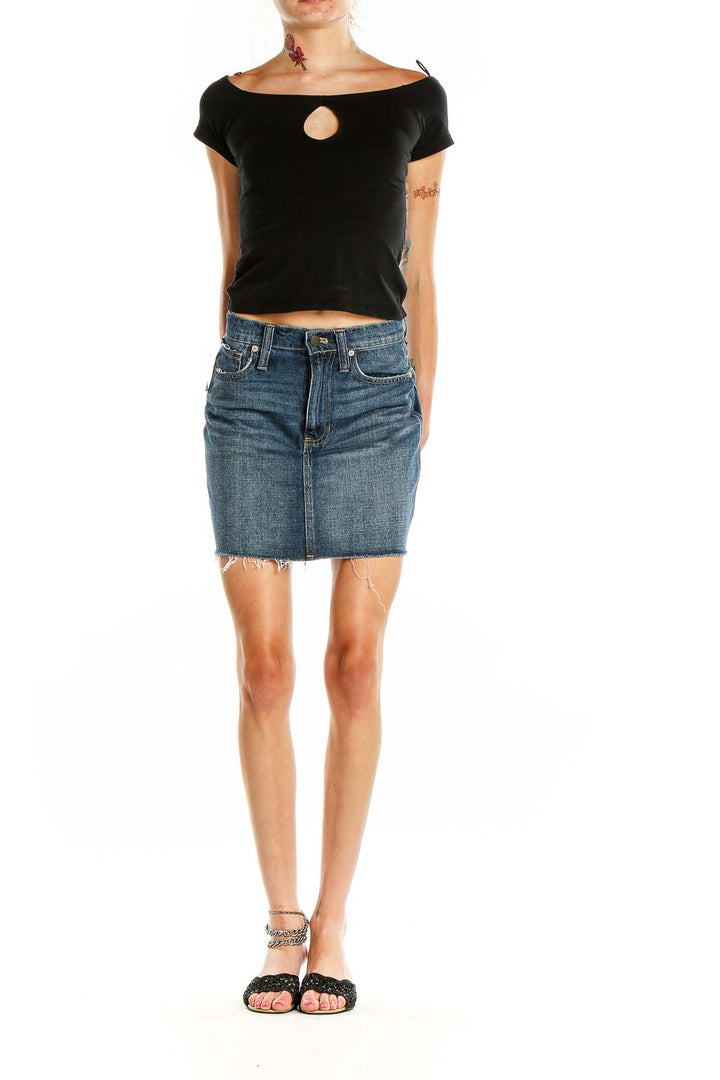 Front view of Madewell blue denim mini skirt with raw hem