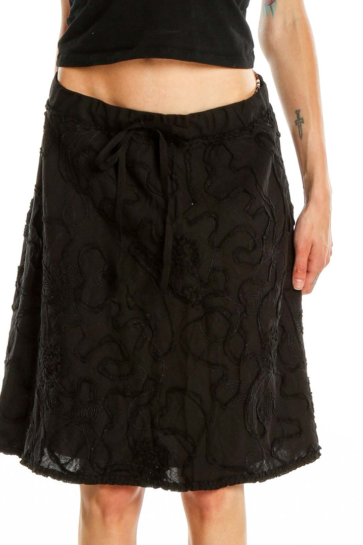 Front view of Max Studio black floral embroidered A-line skirt