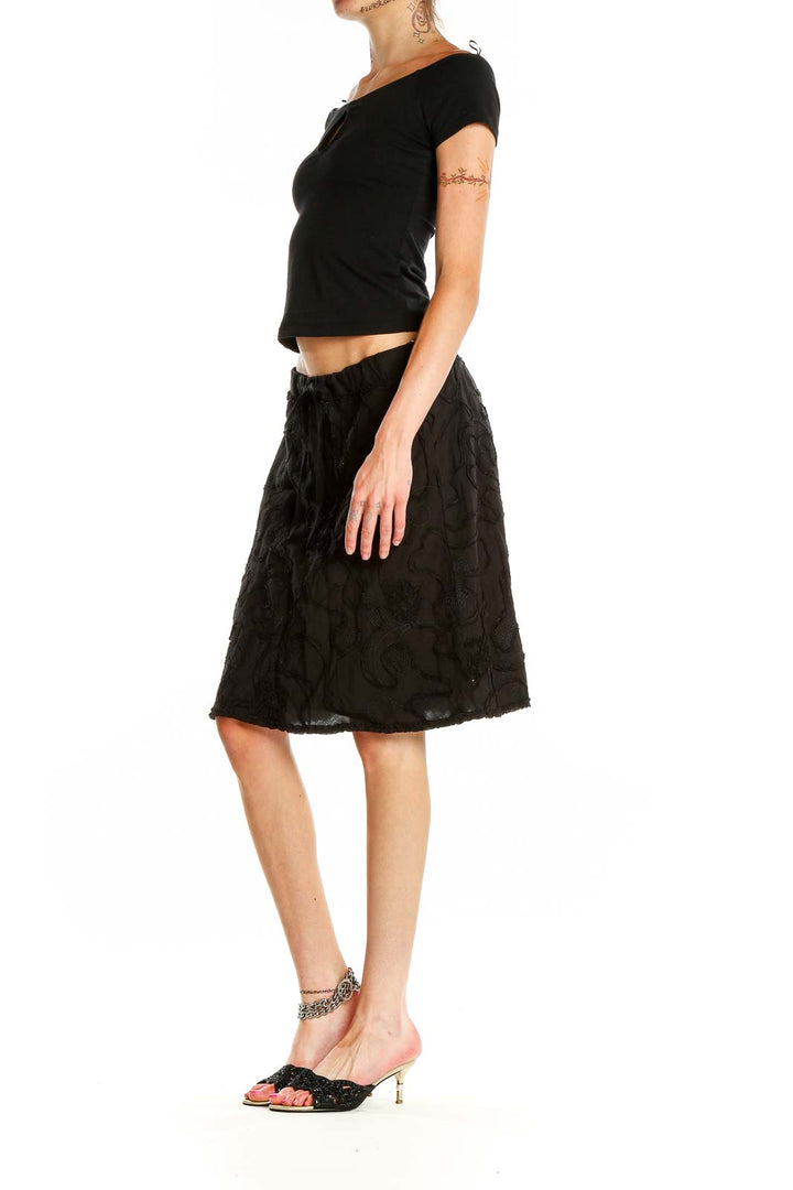 Front view of Max Studio black floral embroidered A-line skirt