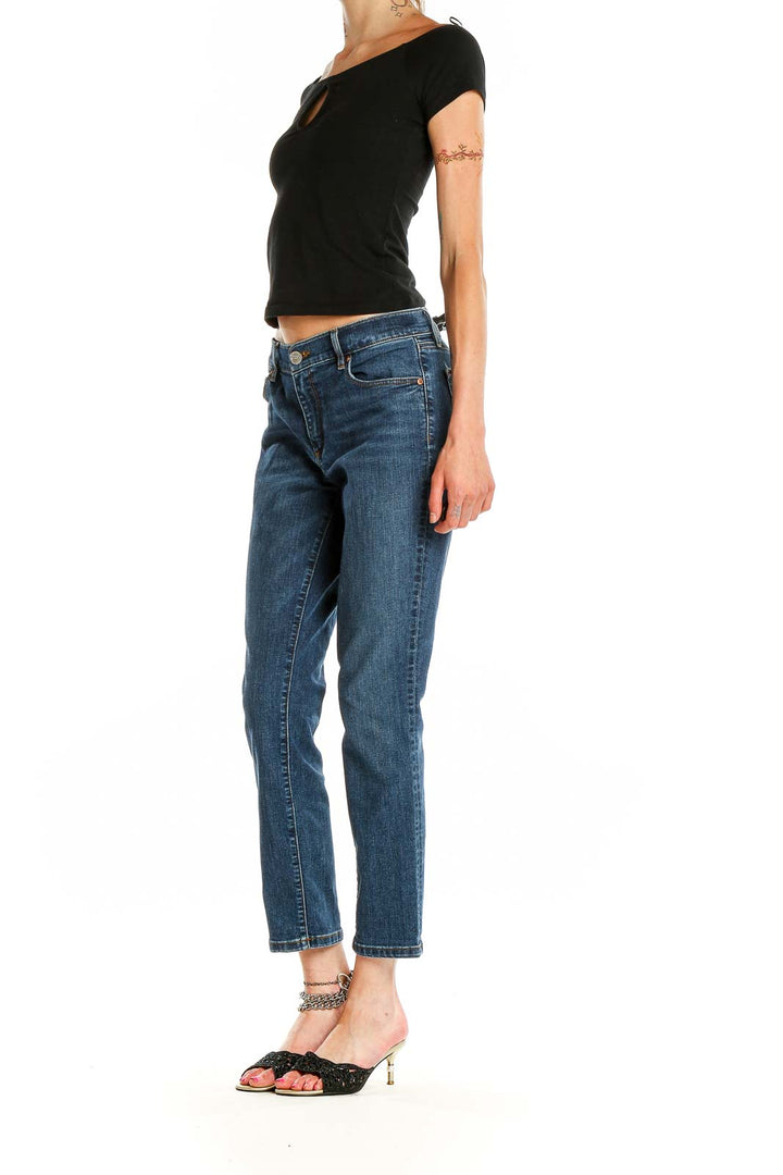 Front view of LOFT blue cropped straight leg jeans on model