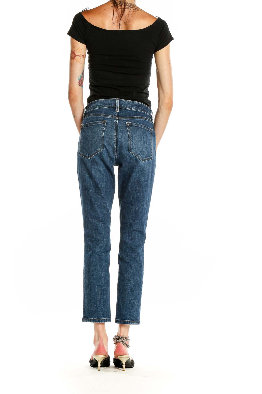 Side view of LOFT blue cropped straight leg jeans on model