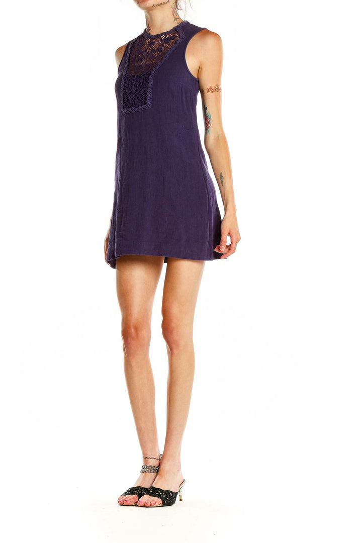 Front view of purple Free People mini dress with lace crochet panel