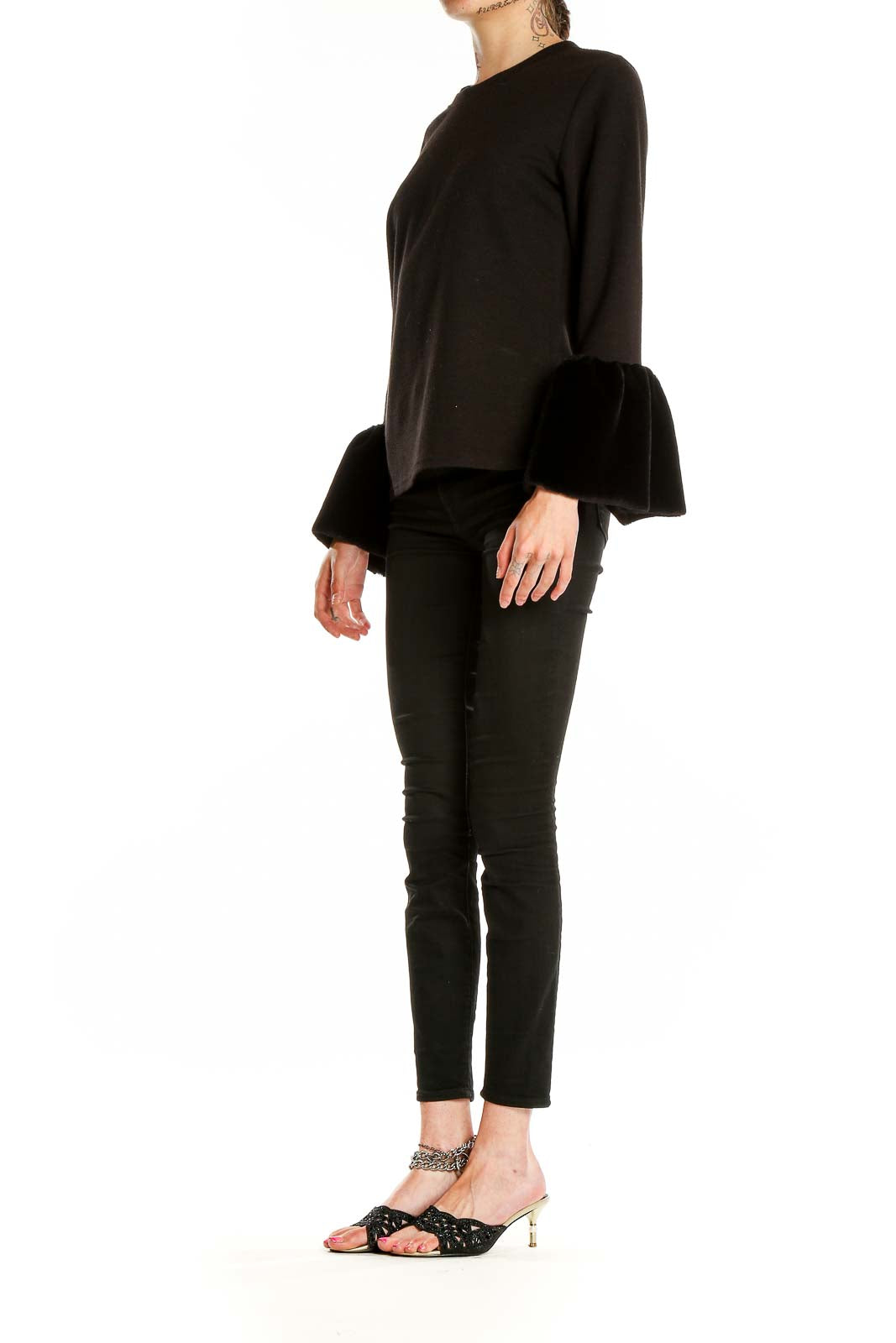 Front view of Beulah black knit sweater with fur cuffs