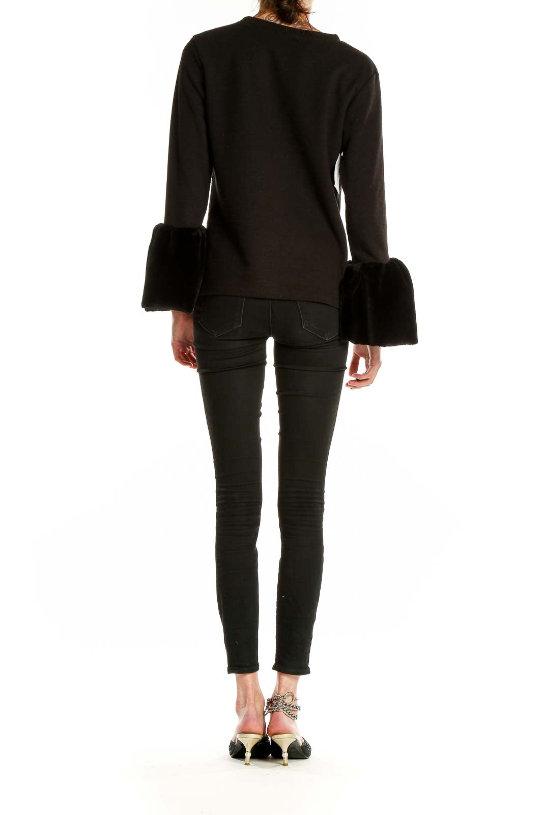 Back view of Beulah black knit sweater with fur cuffs