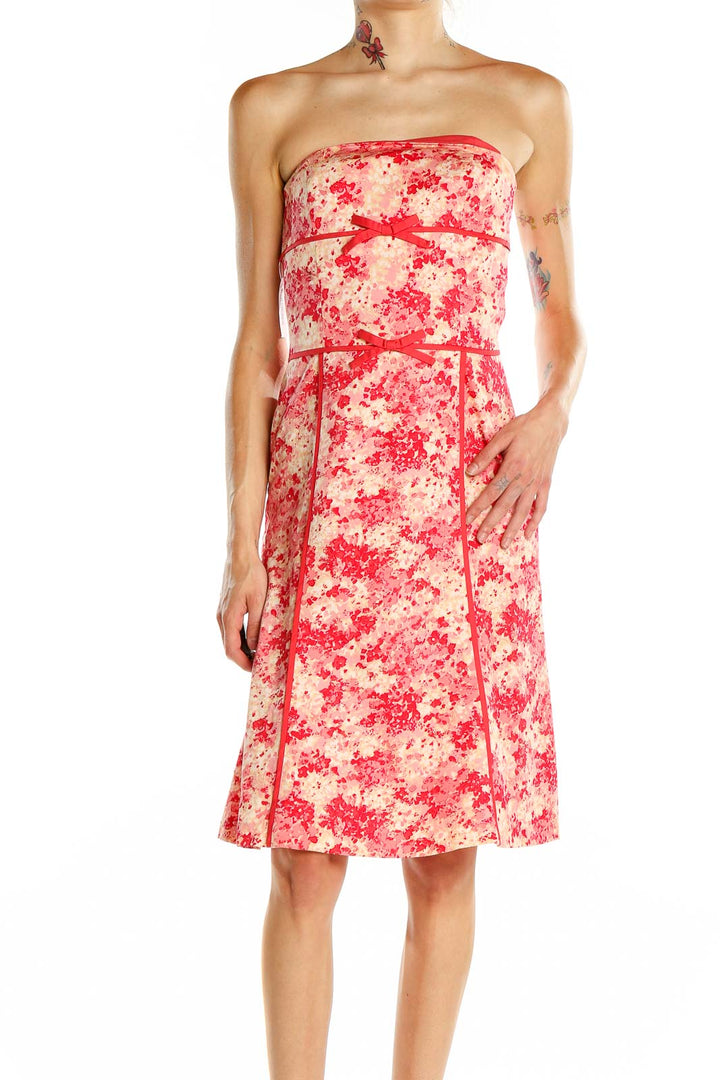 Front view of Ann Taylor pink floral strapless cocktail dress with red ribbon accents