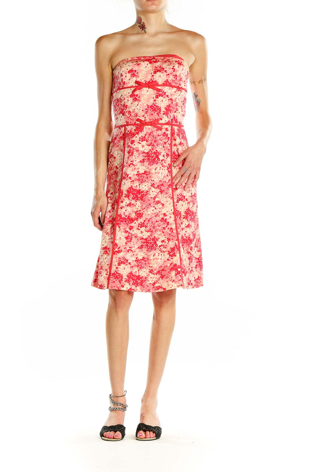 Front view of Ann Taylor pink floral strapless cocktail dress with red ribbon accents