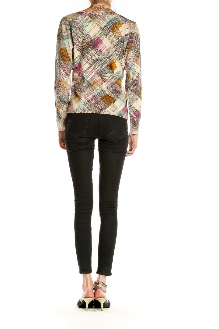 Back view of Talbots multicolor abstract print V-neck blouse with model wearing black pants