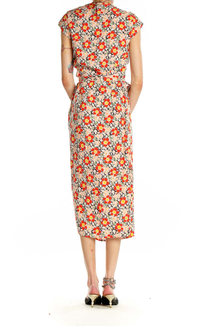 Back view of J.Crew Mercantile orange floral wrap midi dress on model