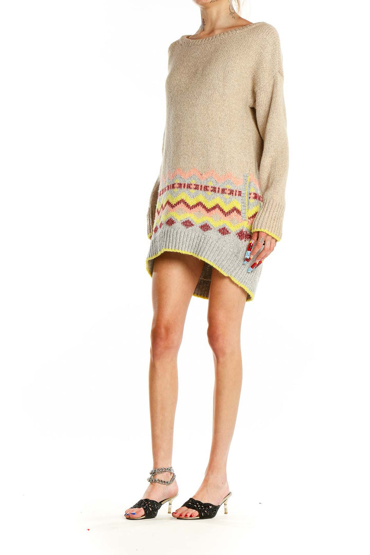 Front view of Victoria's Secret beige knit sweater dress with colorful pattern at hem