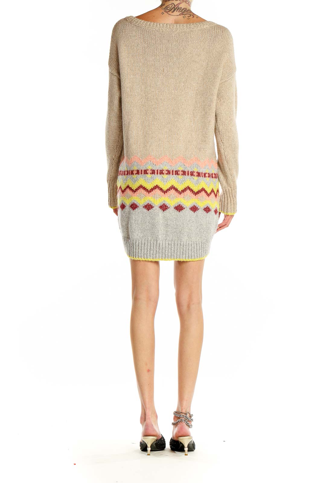 Back view of Victoria's Secret beige knit sweater dress showing colorful zigzag pattern