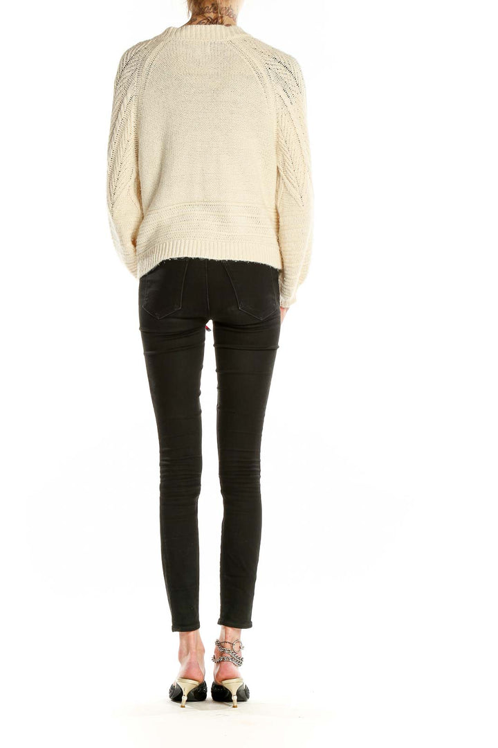 Back view of cream chunky knit cardigan showing relaxed fit and texture