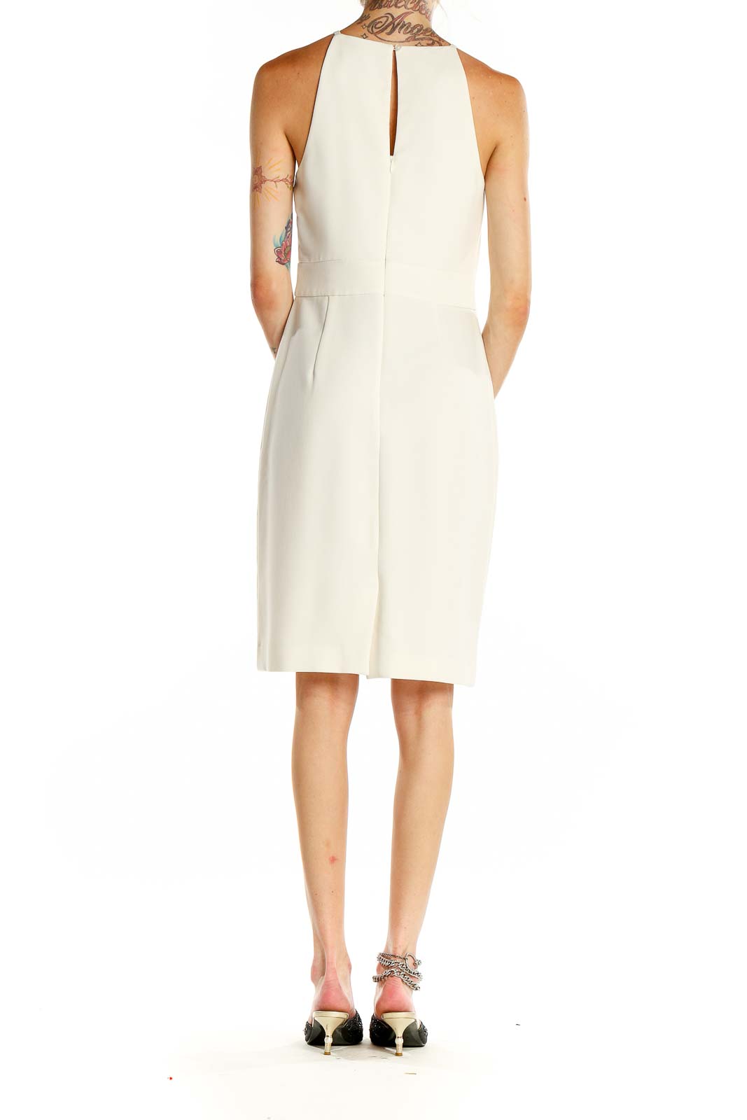 Back view of white halter neck sheath dress from Banana Republic showing keyhole detail