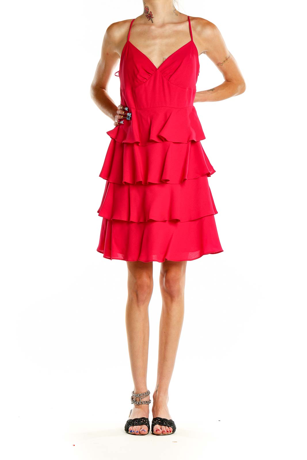 Front view of Patricia Field red tiered ruffle cocktail dress with V-neck and spaghetti straps