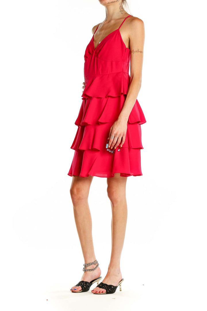 Front view of Patricia Field red tiered ruffle cocktail dress with V-neck and spaghetti straps