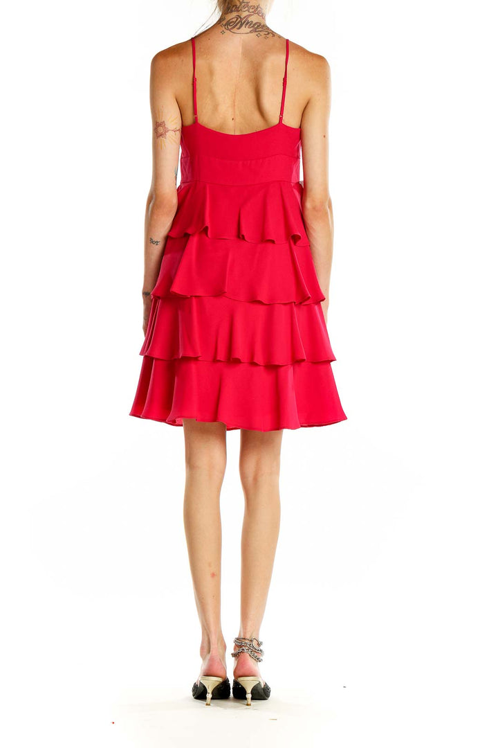 Back view of Patricia Field red tiered ruffle cocktail dress showing spaghetti straps and flowing ruffles