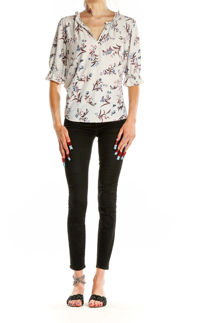 Front view of Melloday white floral print blouse with ruffle sleeves