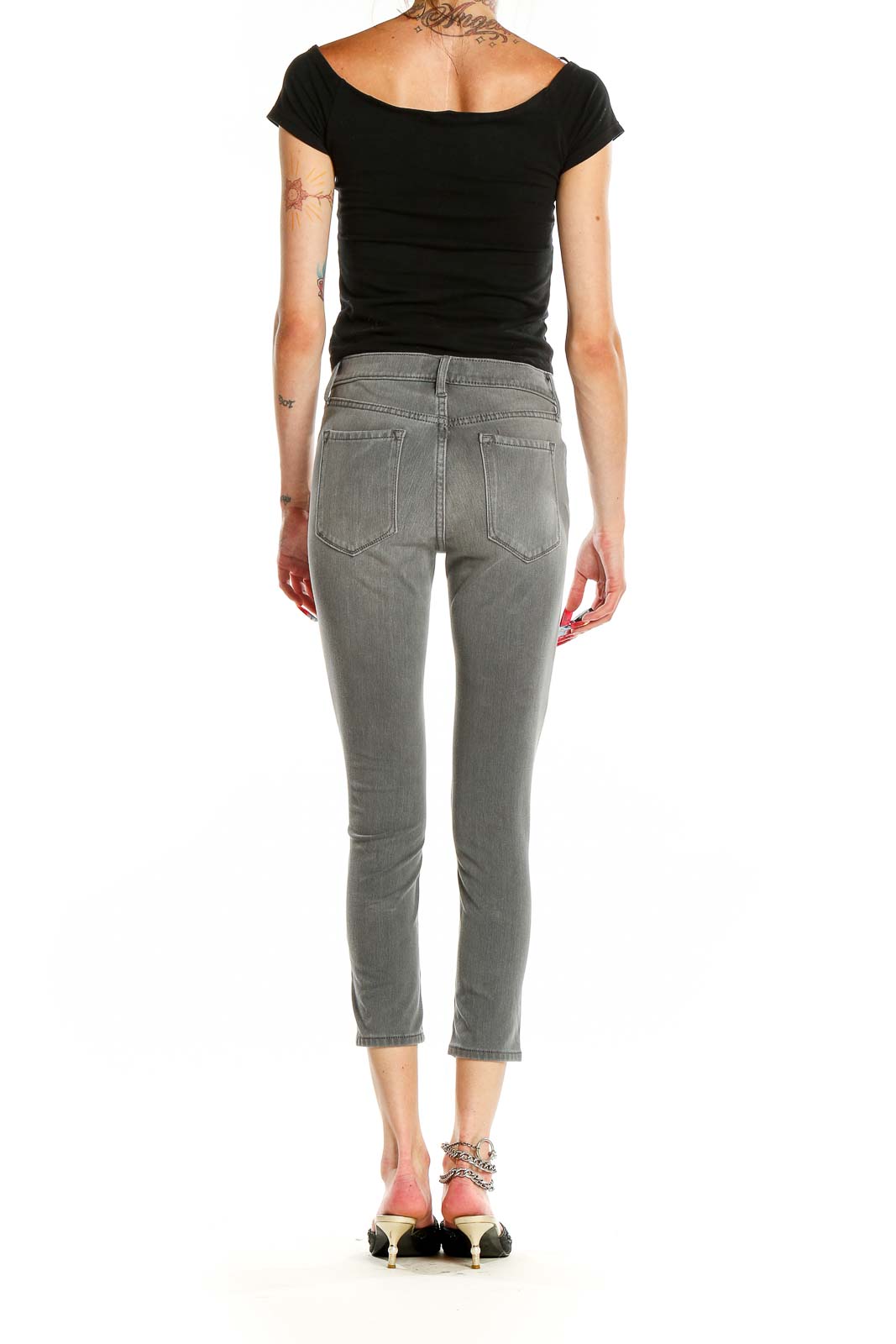 Back view of Banana Republic gray cropped skinny jeans on model