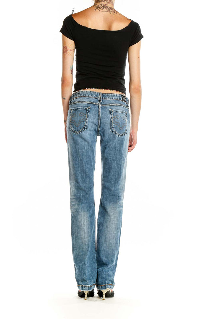 Back view of ReRock for Express light blue distressed bootcut jeans on model