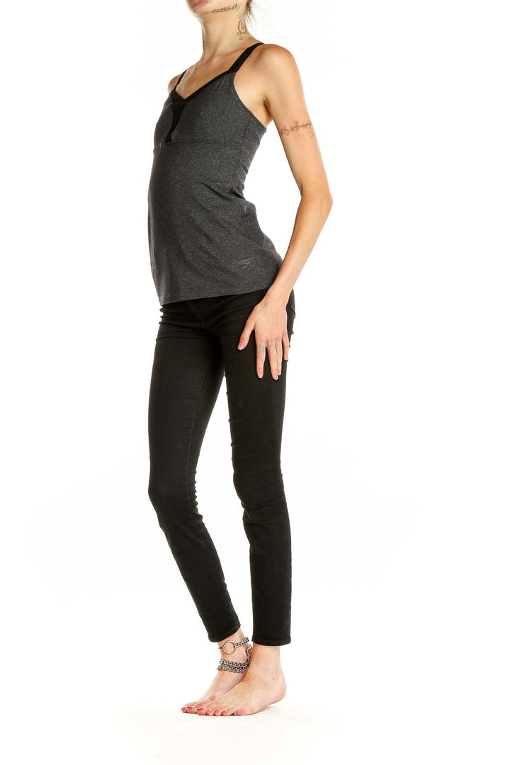 Front view of charcoal gray Beyond Yoga athletic tank top with black trim