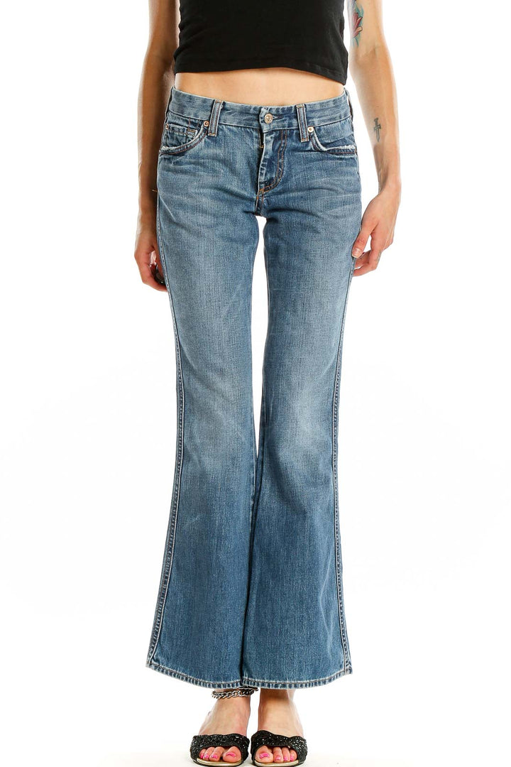 Front view of 7 For All Mankind blue flared jeans on model