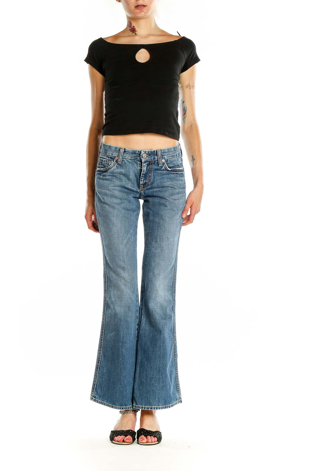 Front view of 7 For All Mankind blue flared jeans on model