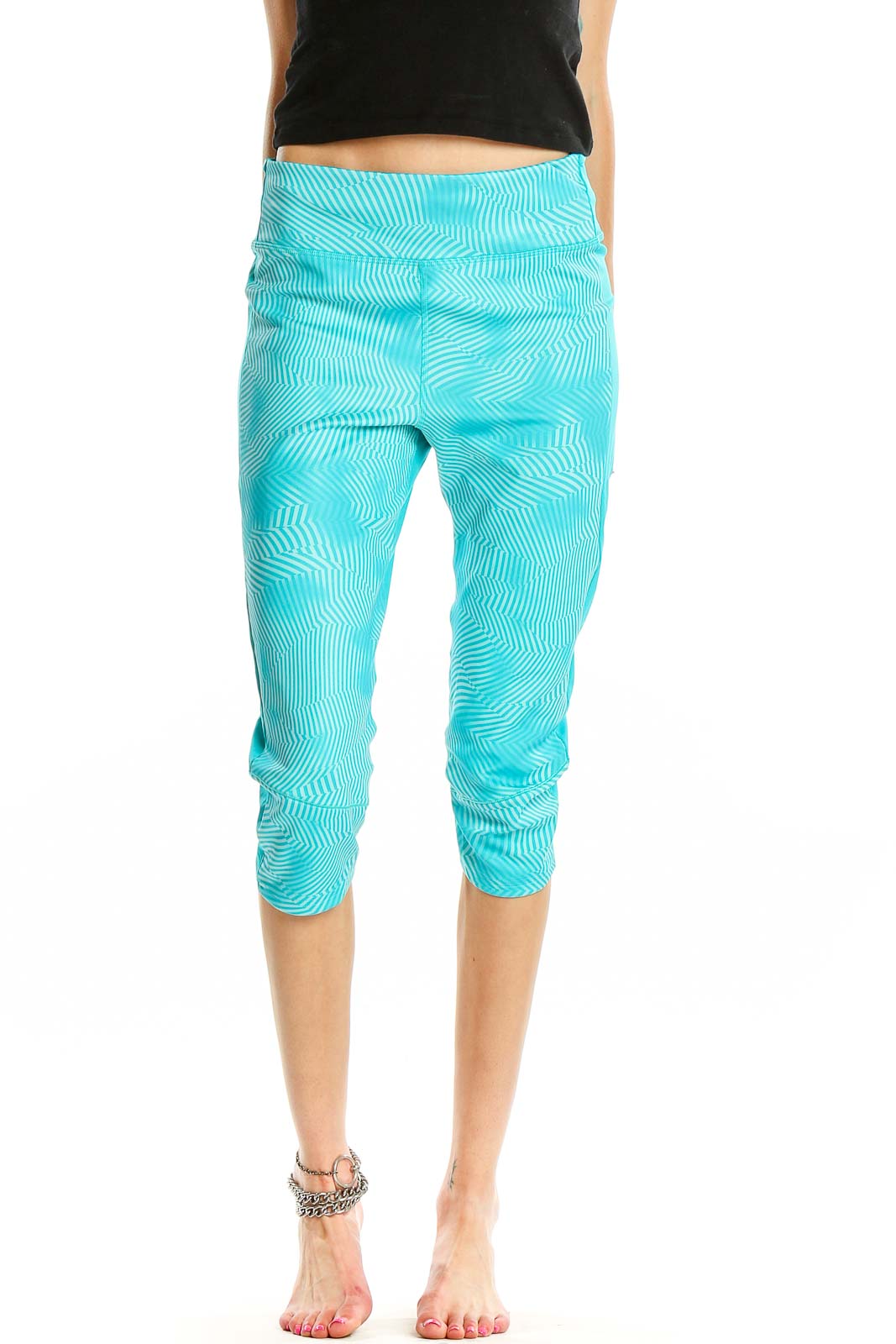 Front view of Adidas turquoise capri leggings with wave pattern