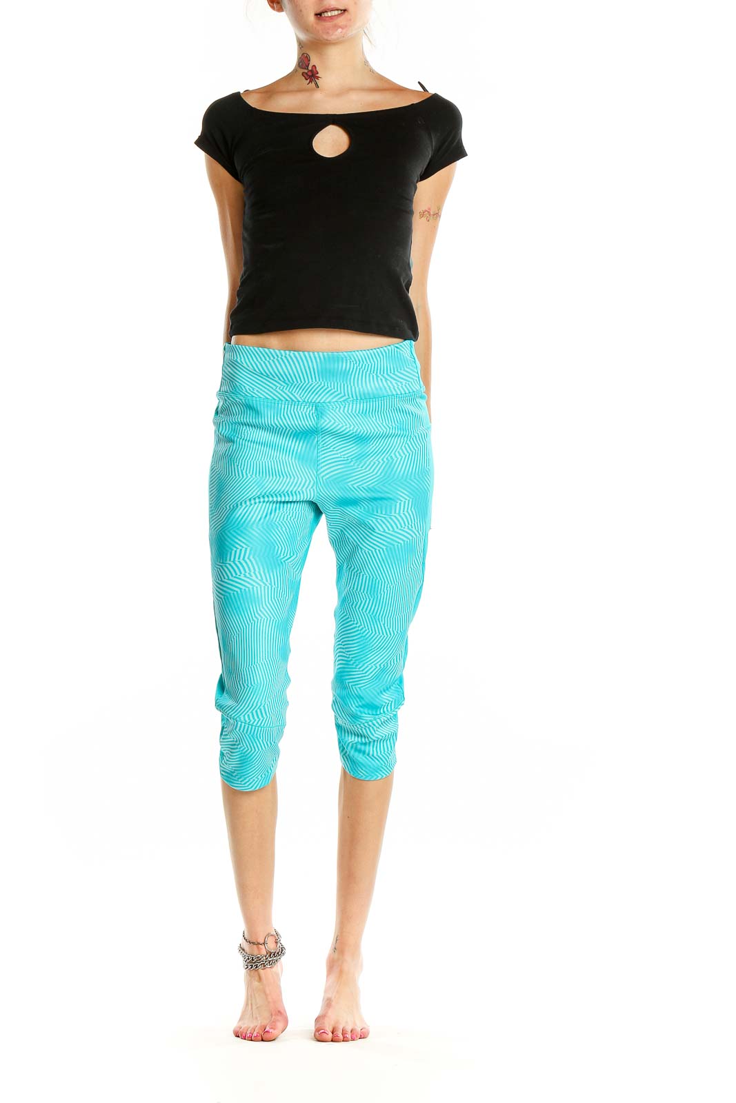 Front view of Adidas turquoise capri leggings with wave pattern