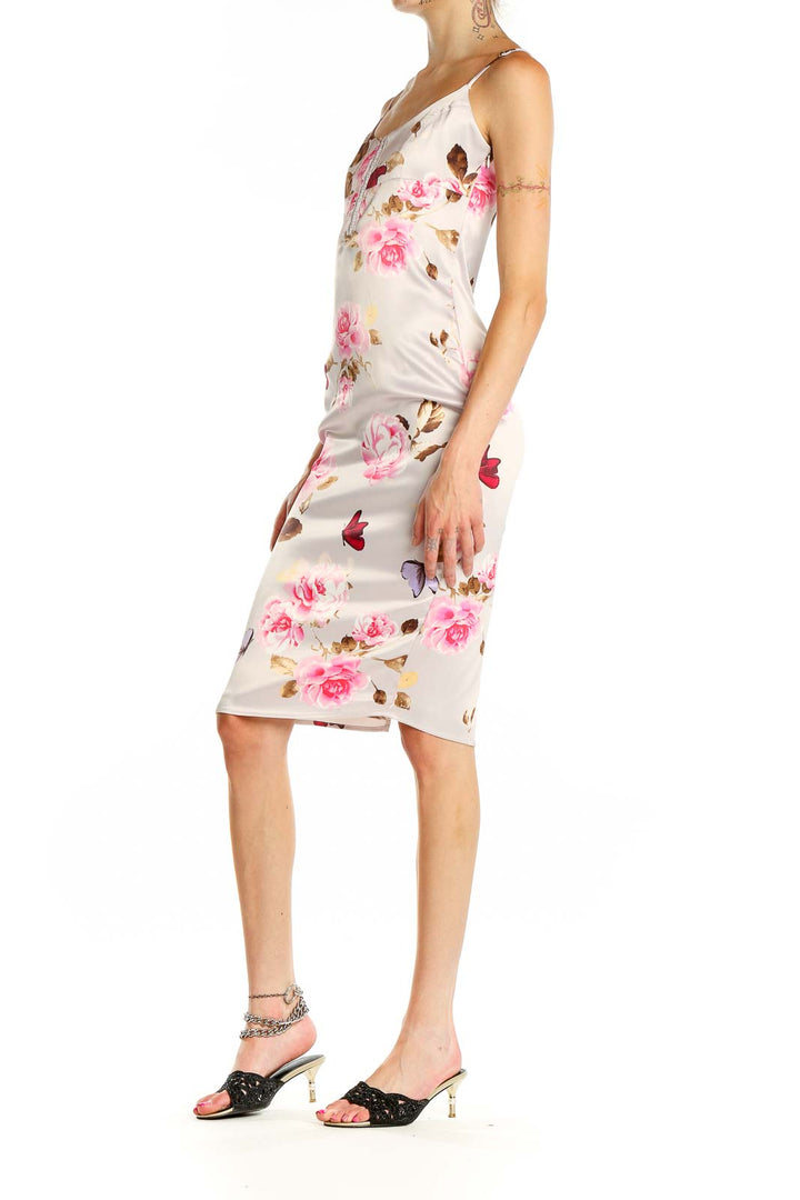 Front view of Victoria's Secret beige floral satin slip dress with pink roses and butterflies