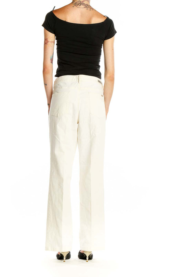 Side view of model wearing MICHAEL Michael Kors white wide-leg linen blend pants