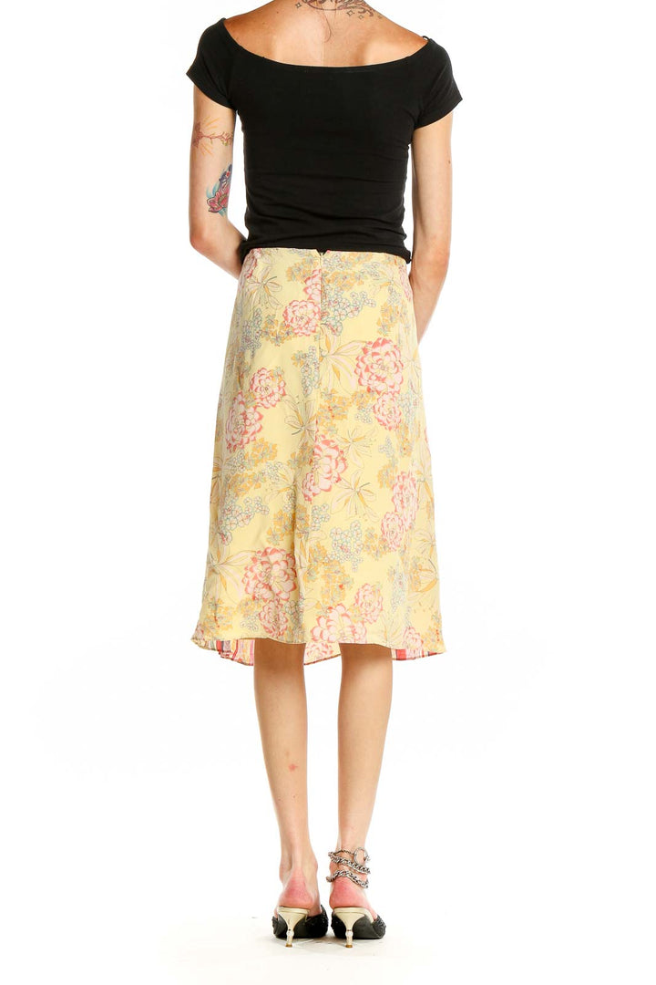 Back view of St. John Sport yellow floral print midi skirt showing full pattern