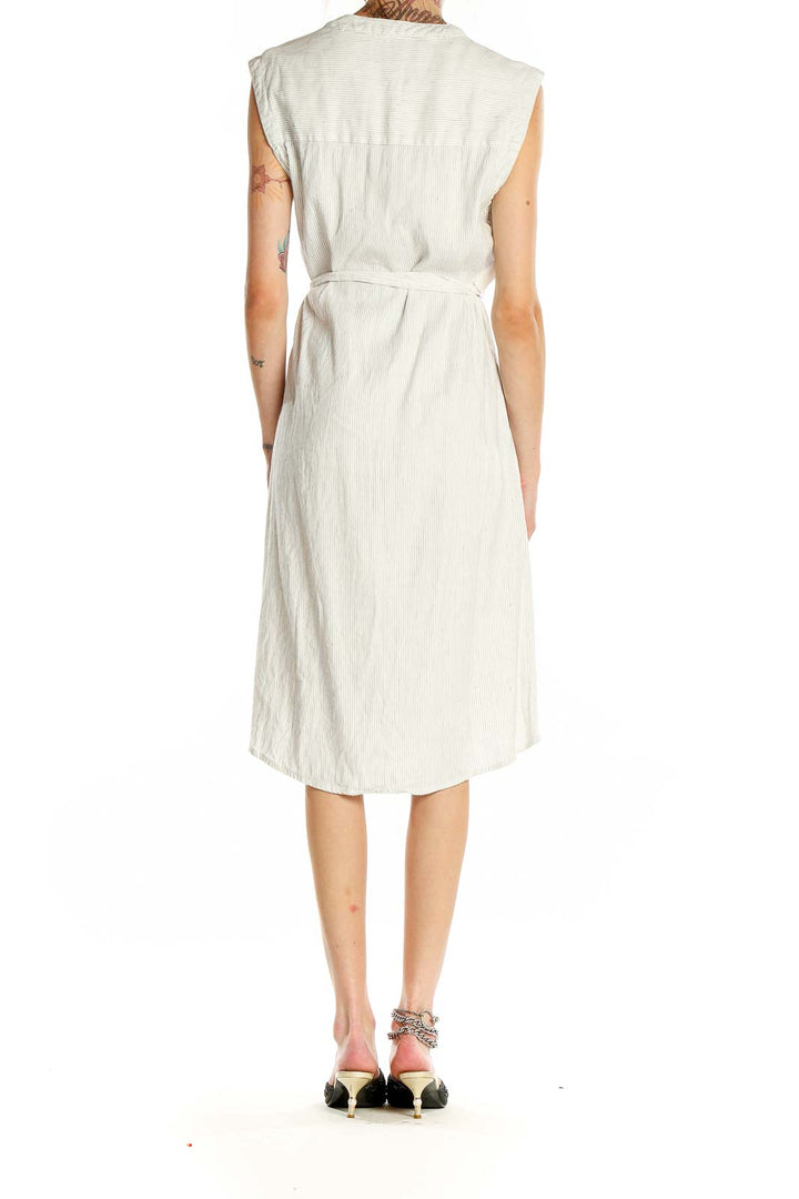 Back view of white sleeveless wrap midi dress by Tahari