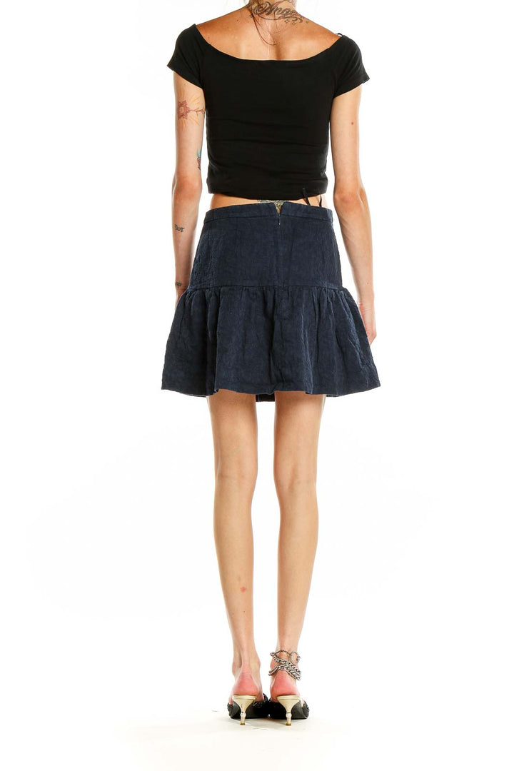 Back view of J.Crew navy flared mini skirt on model