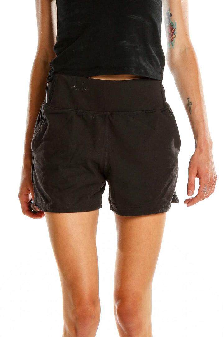 Front view of black Vitality athletic shorts on model