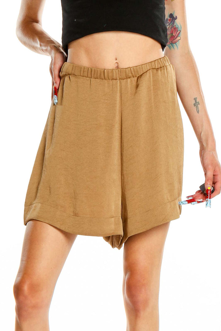 Front view of tan Vince relaxed fit shorts with elastic waistband